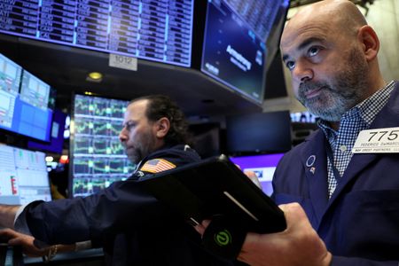 Nasdaq ends lower ahead of big tech earnings, focus on Fed