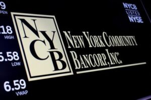 A screen displays the trading information for New York Community