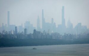FILE PHOTO: Haze and smoke shrouds Manhattan skyline from Canadian