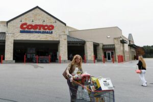 FILE PHOTO: A woman exits a Costco Wholesale retail club