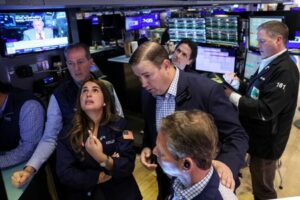 Traders work on the floor of the NYSE in New